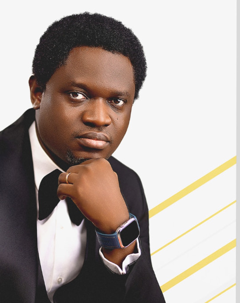 Portrait of Pastor Oyelere Atoyebi in a black tuxedo